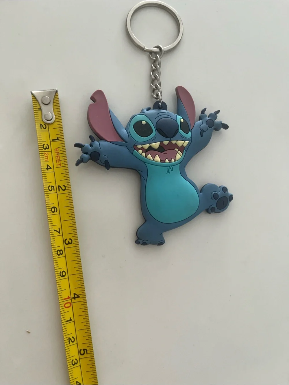 Disney stitch rubber keychain.  Never used, has been sitting in storage.